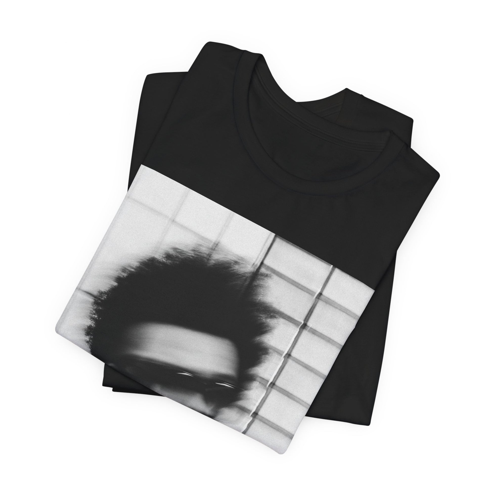 A black graphic t-shirt featuring a blurred graphic of The Weeknd from his 'After Hours' era.