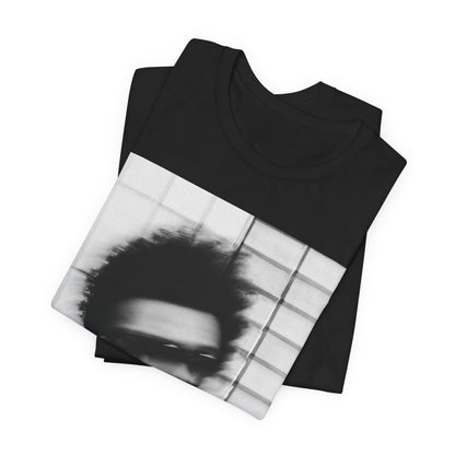 A black graphic t-shirt featuring a blurred graphic of The Weeknd from his 'After Hours' era.