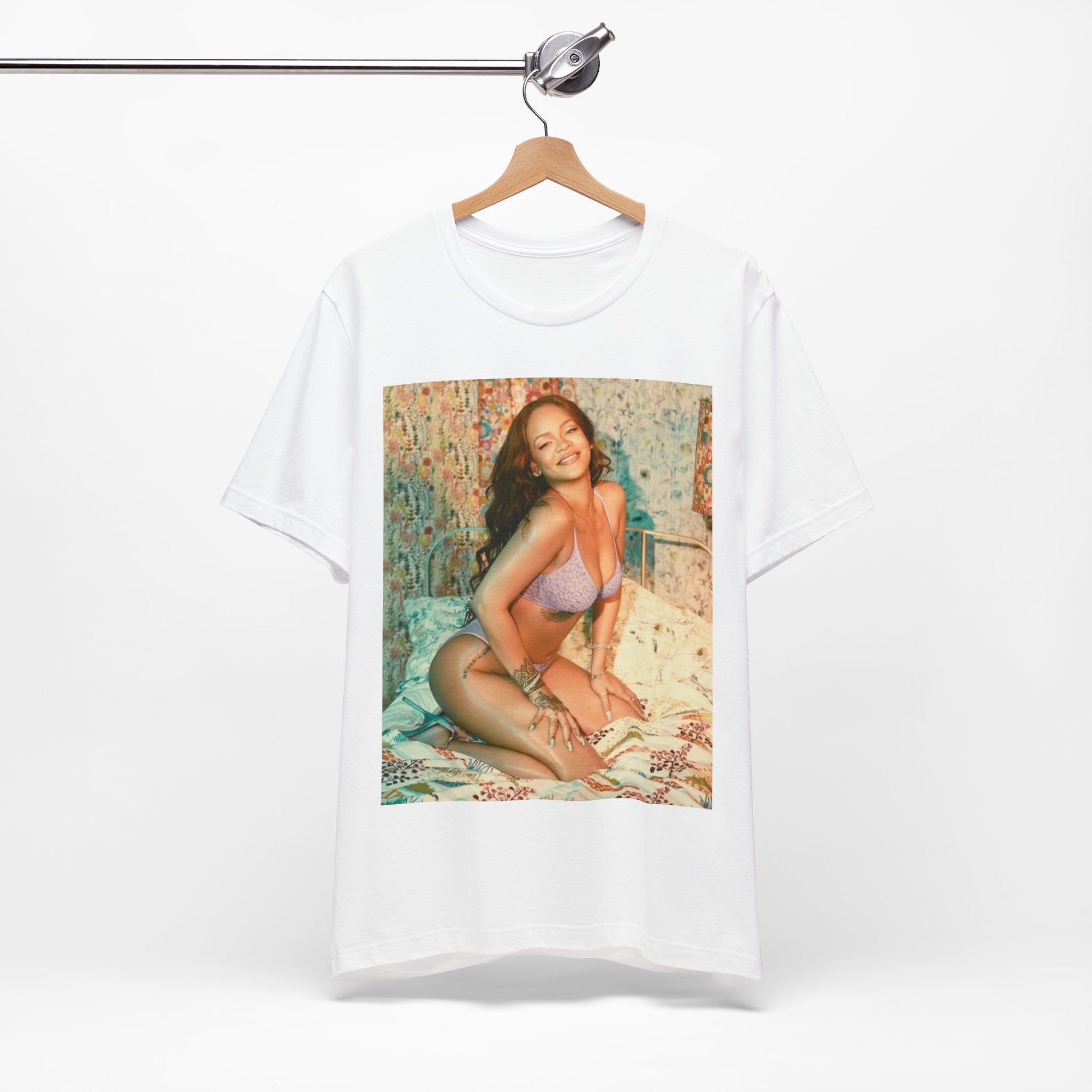 A black graphic t-shirt featuring a graphic of Rihanna with a beauty aesthetic.