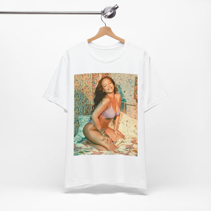 A black graphic t-shirt featuring a graphic of Rihanna with a beauty aesthetic.