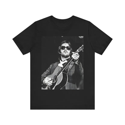 A black graphic t-shirt featuring a graphic of Eric Clapton with a chill blues rock vibe.