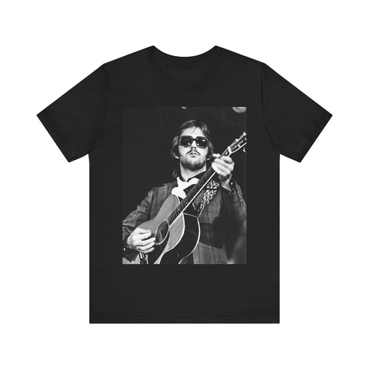 A black graphic t-shirt featuring a graphic of Eric Clapton with a chill blues rock vibe.