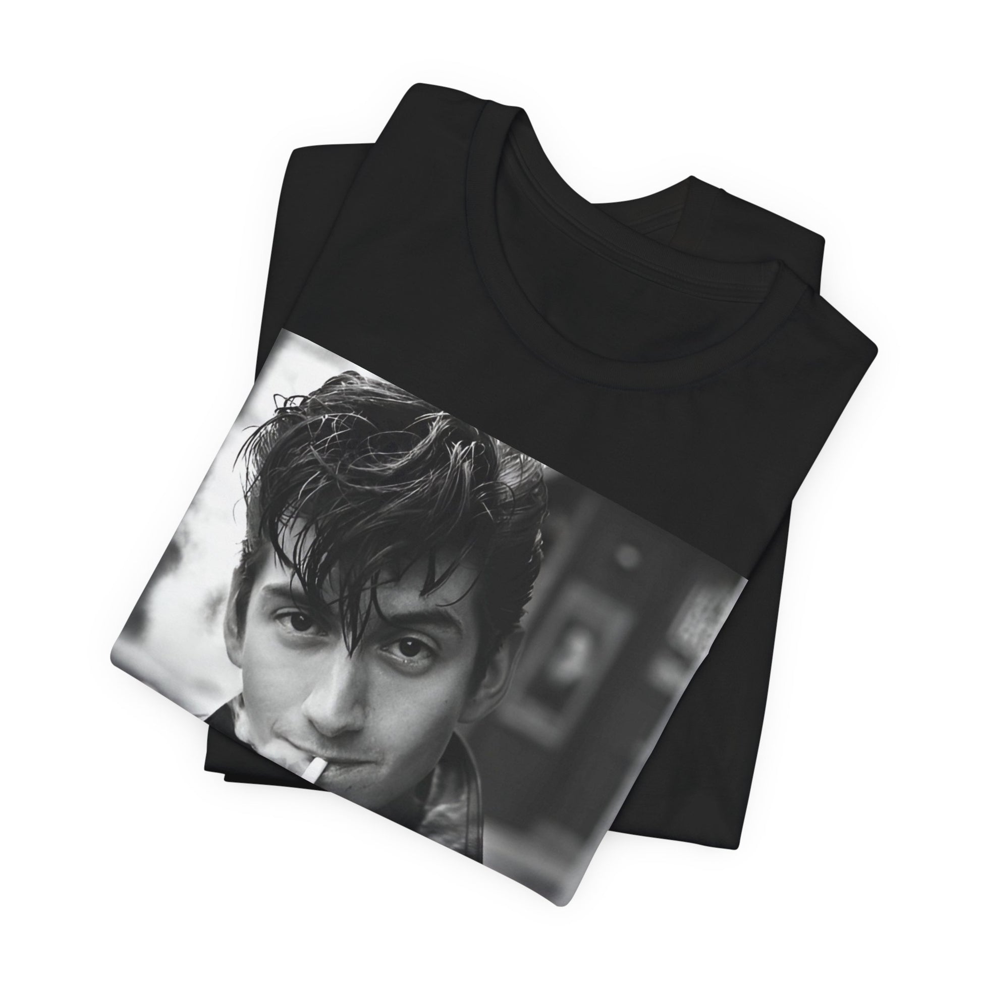 A black graphic t-shirt featuring a graphic of Alex Turner from Arctic Monkeys, in a rock star pose or setting.