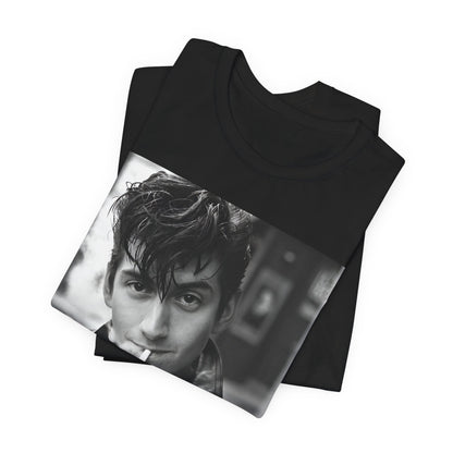 A black graphic t-shirt featuring a graphic of Alex Turner from Arctic Monkeys, in a rock star pose or setting.