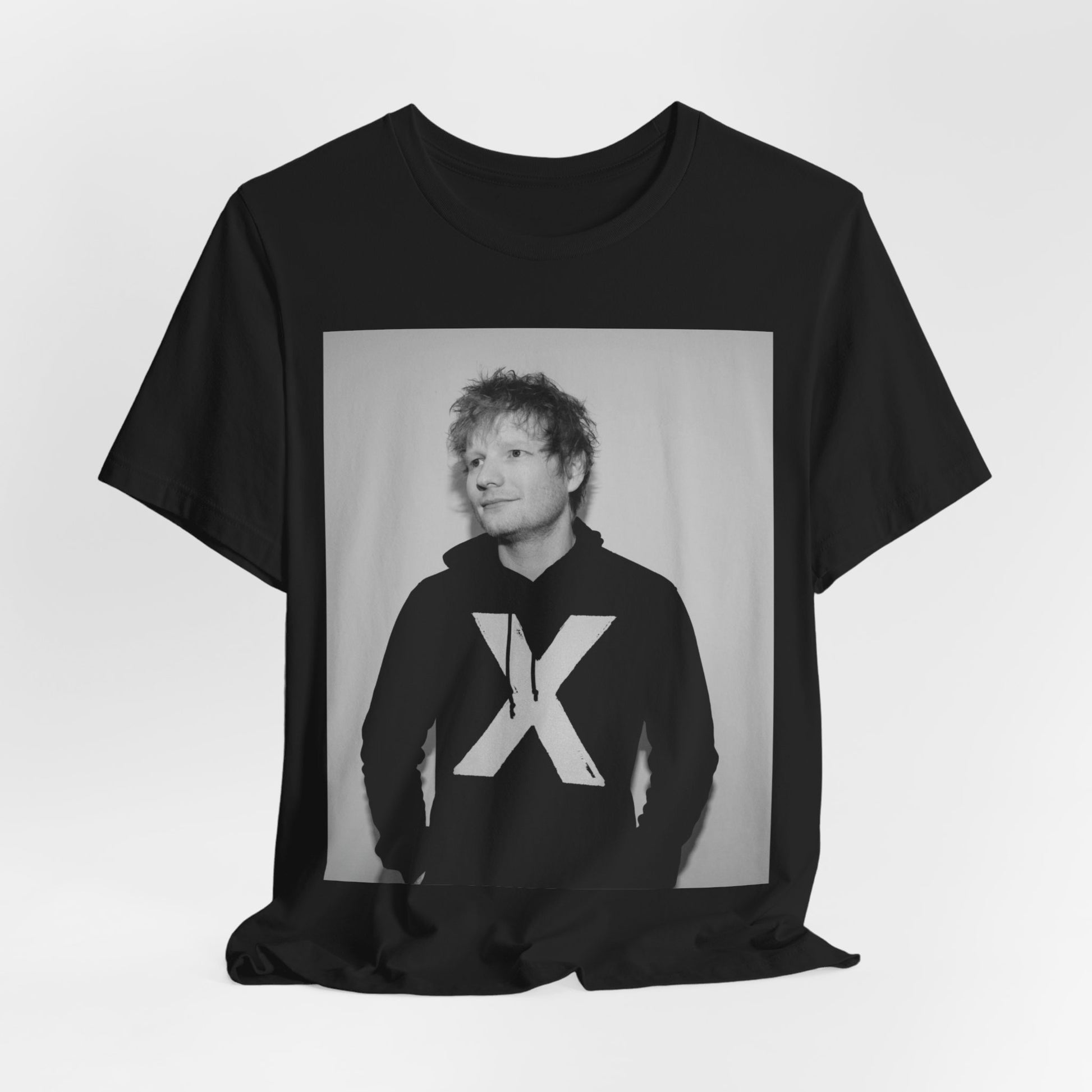 A black graphic t-shirt featuring a black and white graphic related to Ed Sheeran's album 'X'.