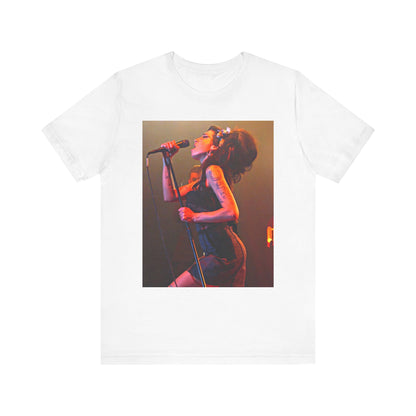 A black graphic t-shirt featuring a dynamic photo of Amy Winehouse performing live, with elements suggesting her 'Back to Black' era.