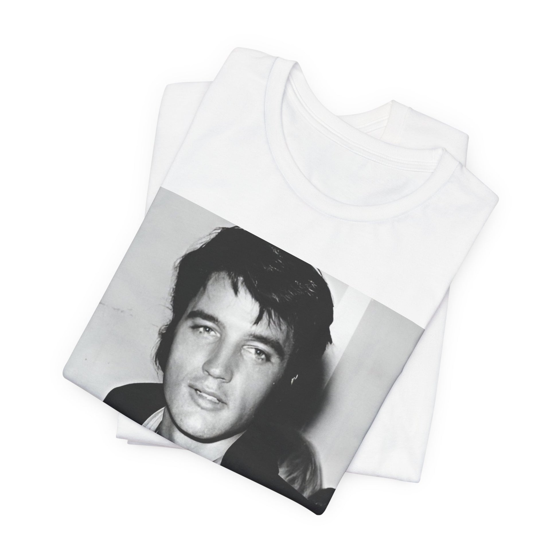 A black graphic t-shirt featuring a black and white rock and roll portrait photo of Elvis Presley.