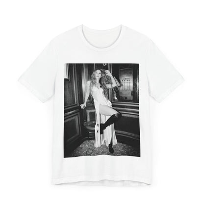 A black graphic t-shirt featuring a retro black and white monochrome graphic or photo of Shakira.