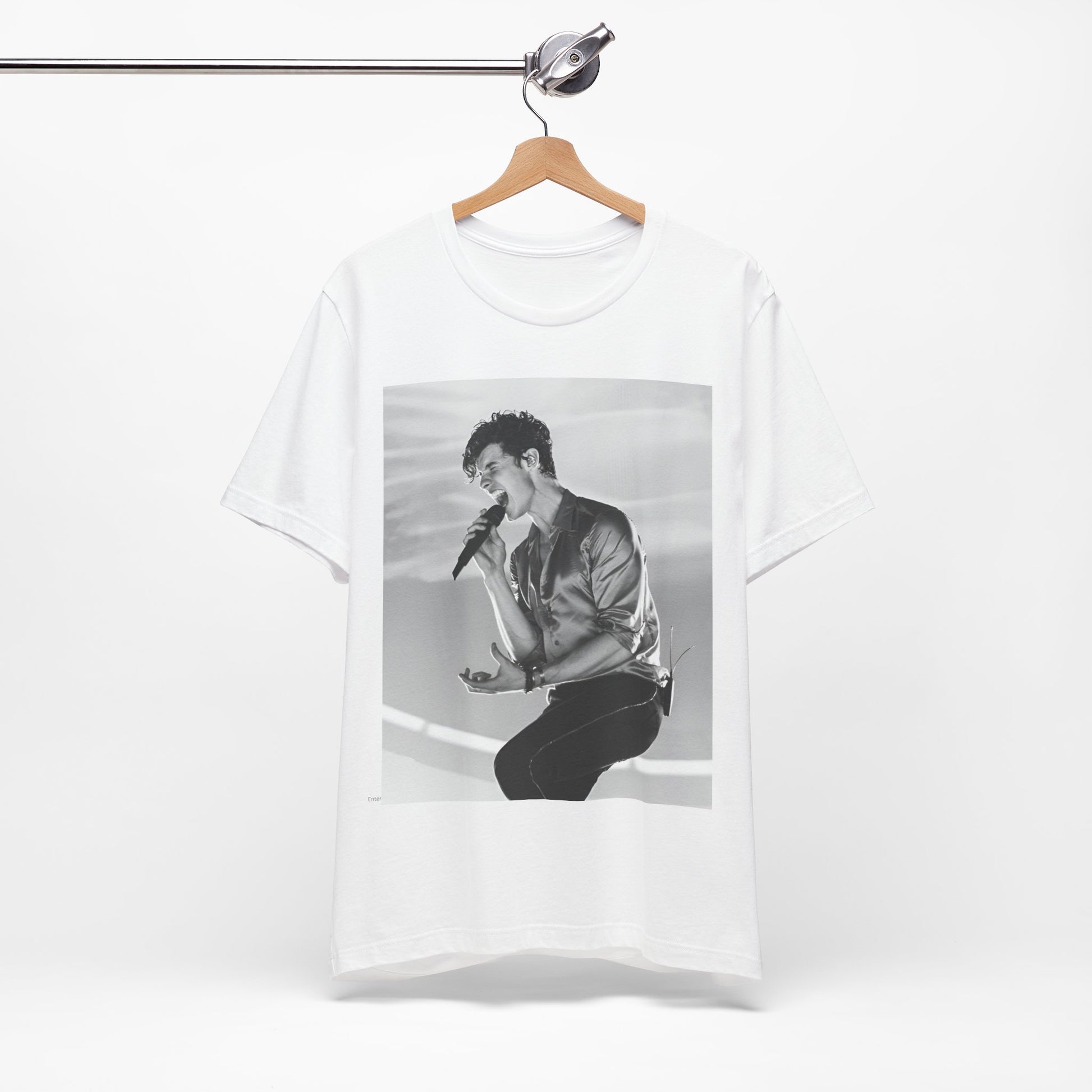 A black graphic t-shirt featuring a black and white graphic or photo of Shawn Mendes as a dreamy pop star.