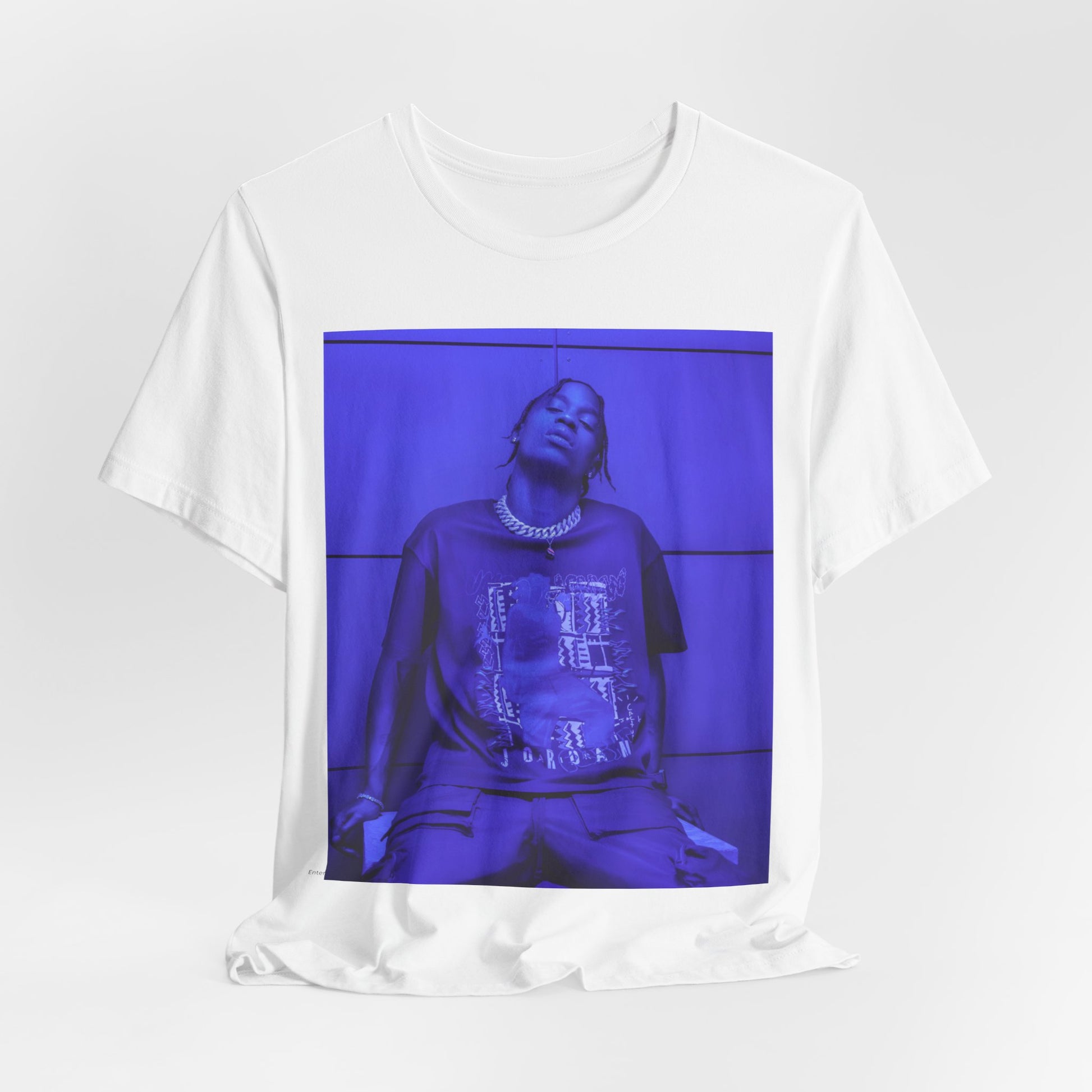 A black graphic t-shirt featuring a timeless trap star graphic of Travis Scott.