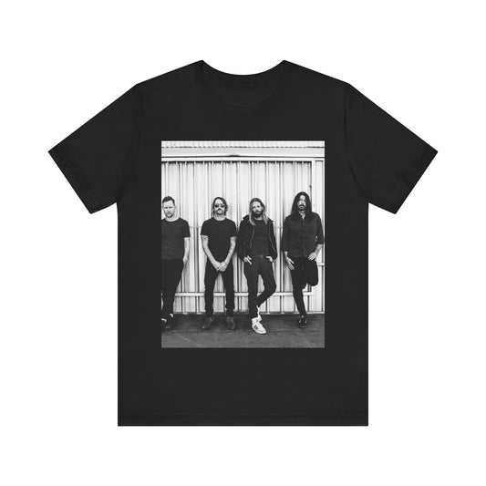 A black graphic t-shirt featuring a photo portrait of the band Foo Fighters.