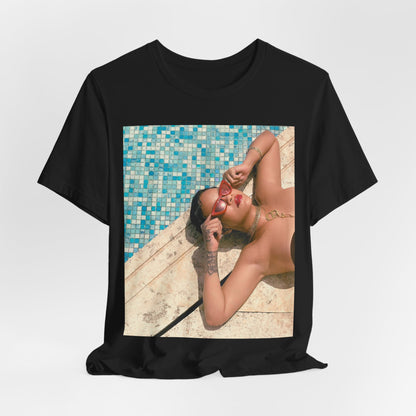 A black graphic t-shirt featuring a graphic of Rihanna in swimwear as a pop star queen.