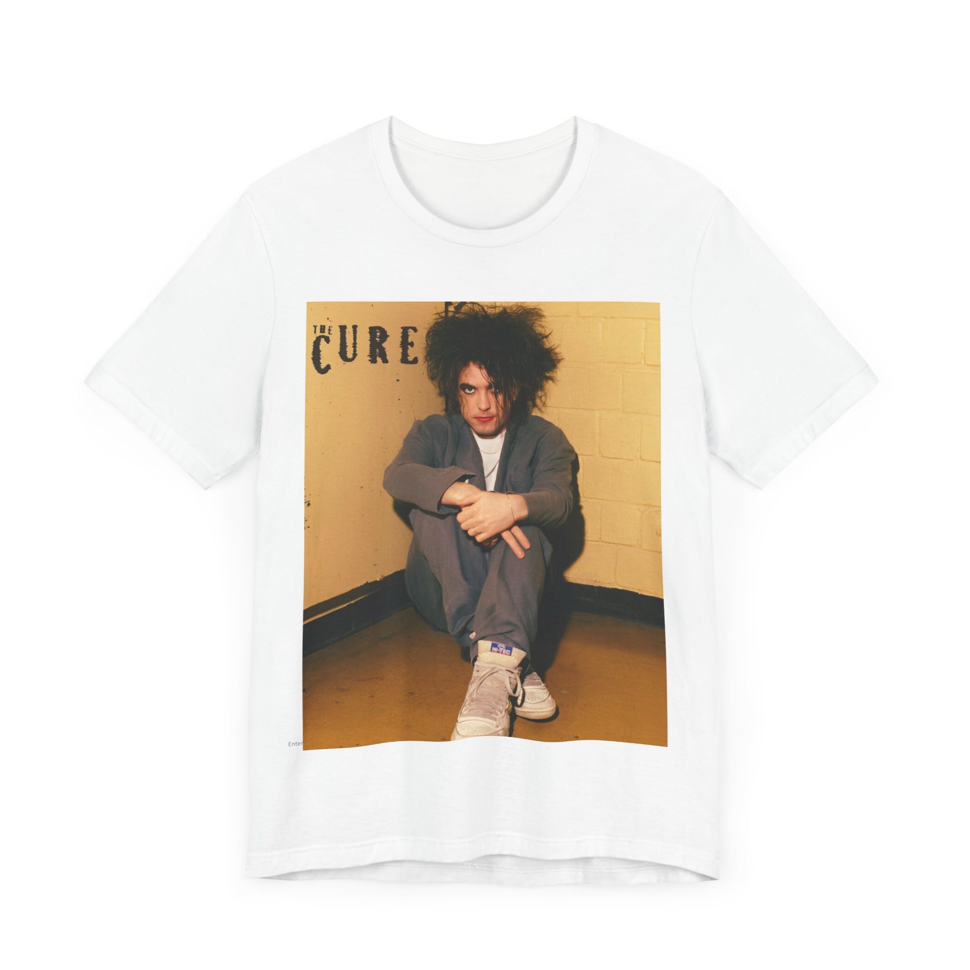 A black graphic t-shirt featuring a bold goth rock superstar graphic of The Cure.