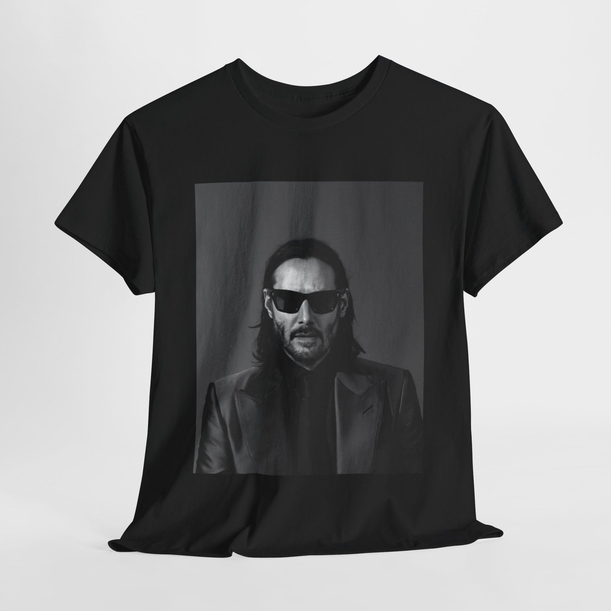 A black graphic t-shirt featuring an aesthetic graphic of Keanu Reeves as an action hero.
