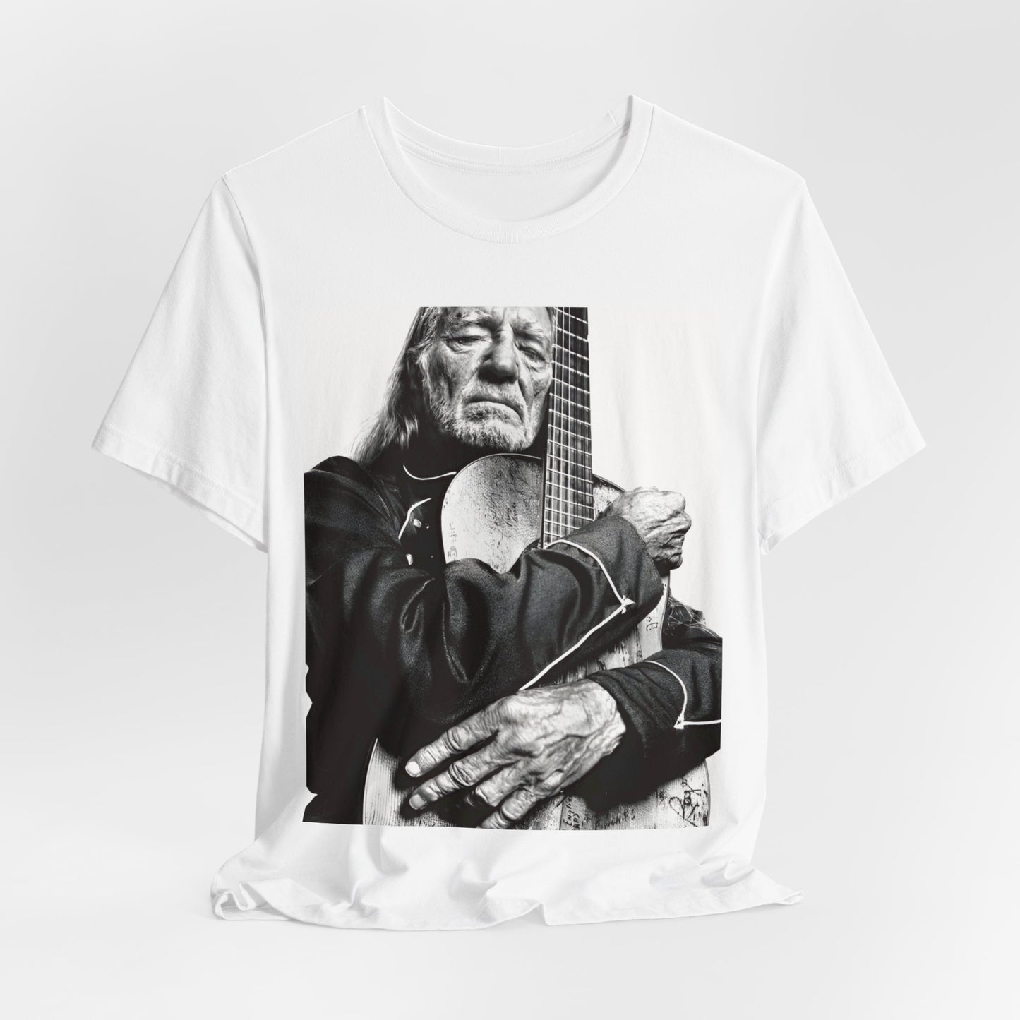 A black graphic t-shirt featuring a vintage country legend graphic of Willie Nelson.