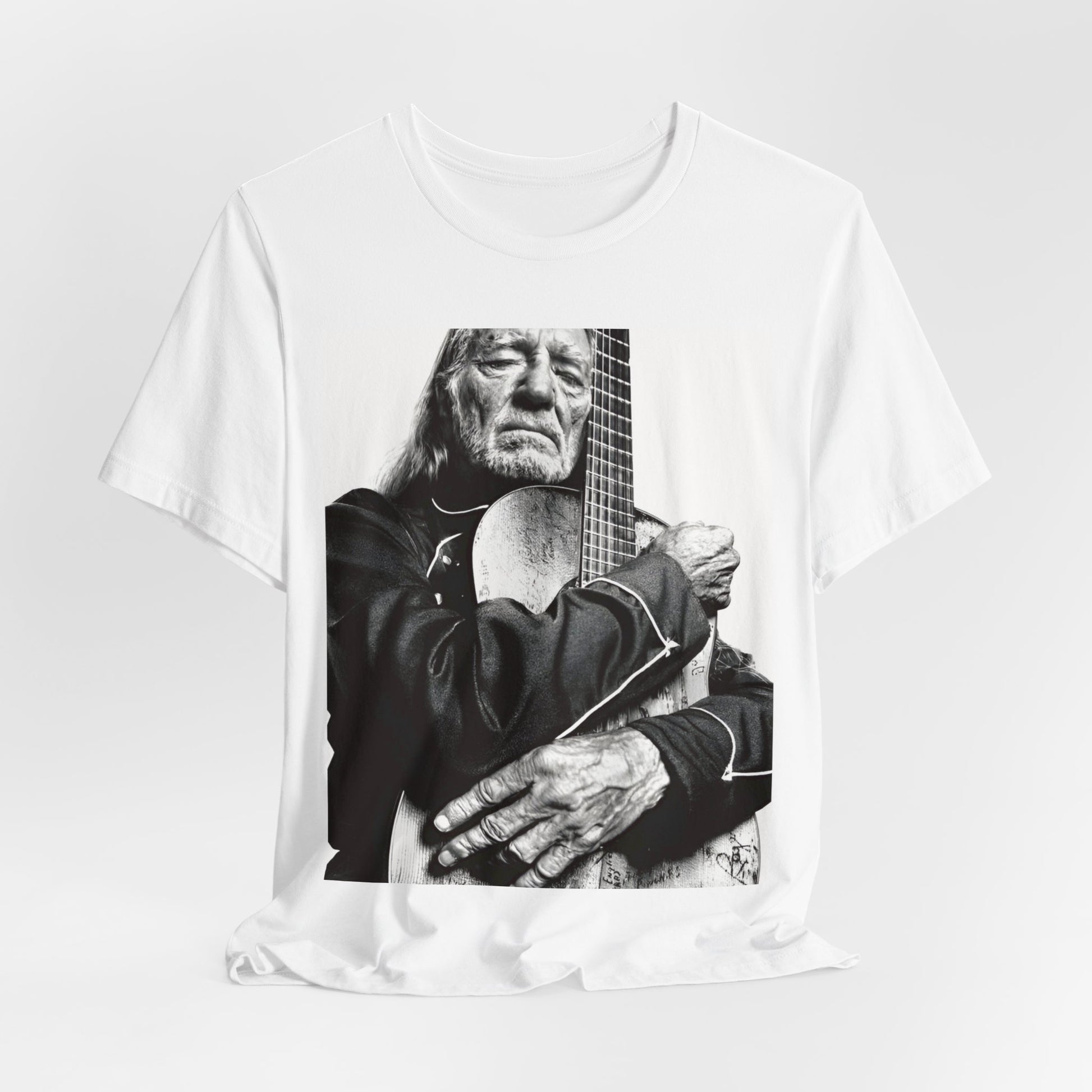 A black graphic t-shirt featuring a vintage country legend graphic of Willie Nelson.