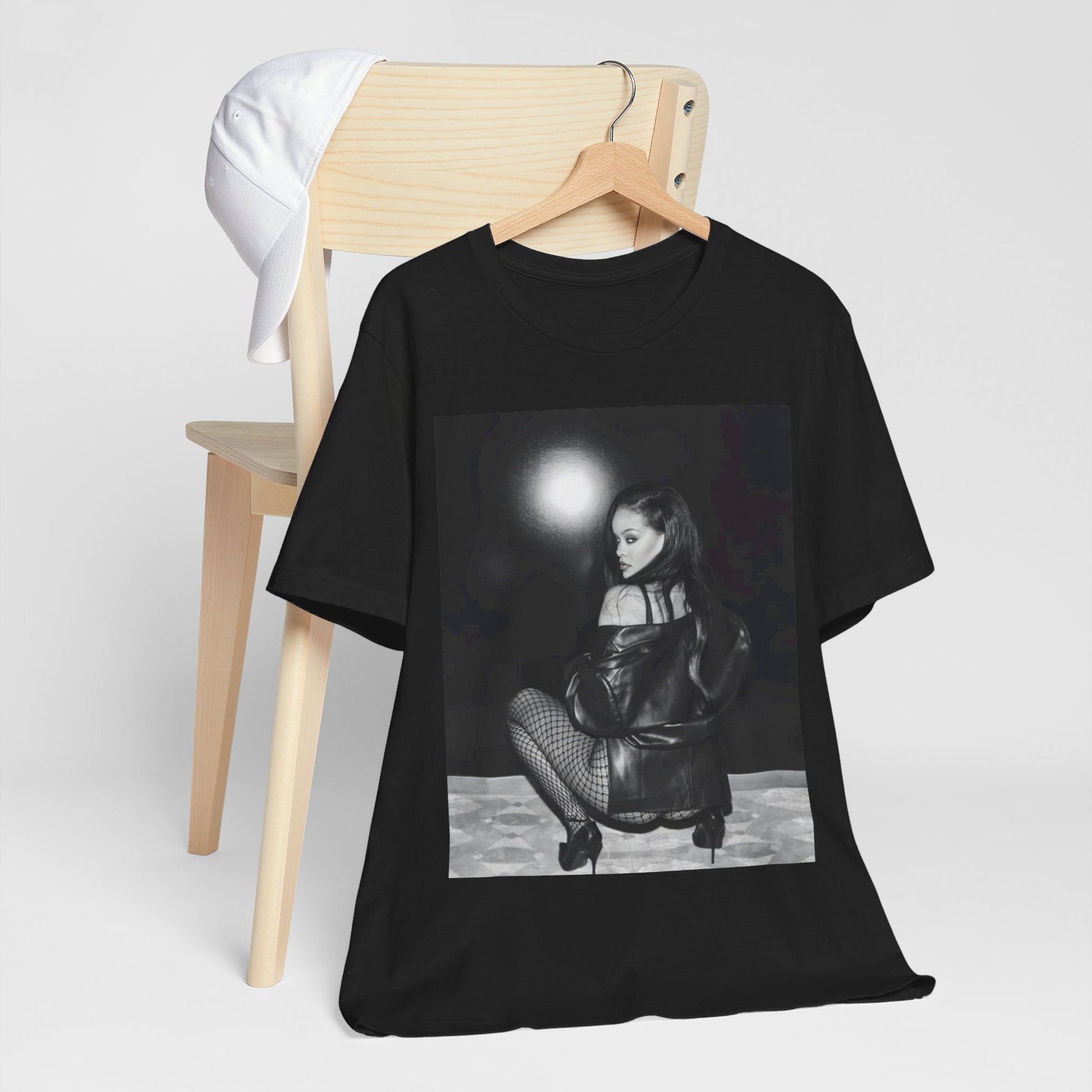 A black graphic t-shirt featuring a black and white sexy graphic of Rihanna.