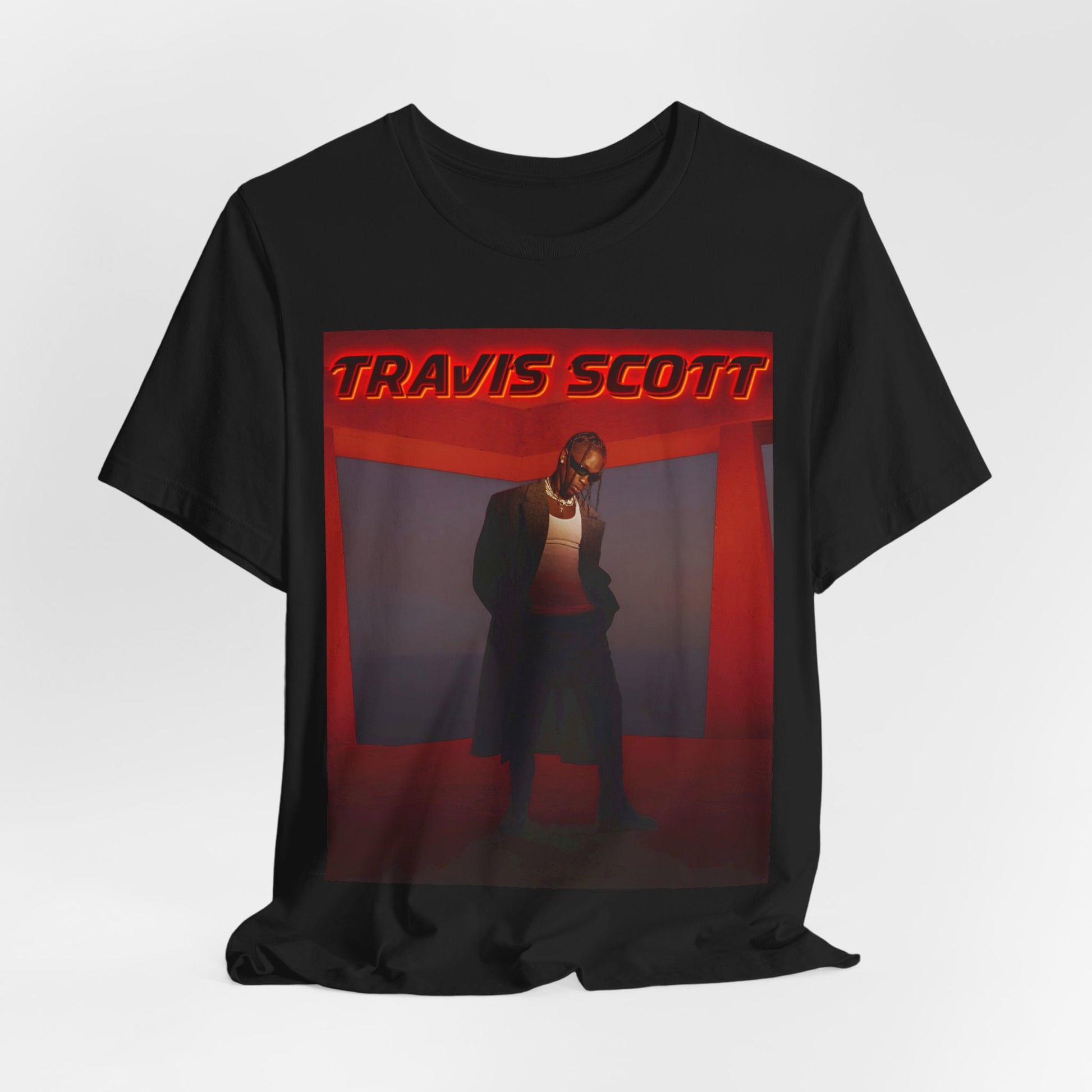 A black graphic t-shirt featuring a graphic of Travis Scott with a dreamy rap soundscape aesthetic.