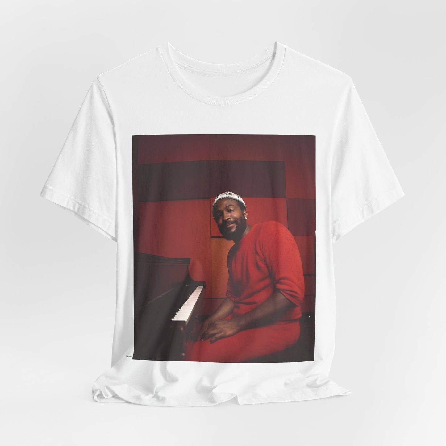 A black graphic t-shirt featuring a retro photo of Marvin Gaye playing the piano.