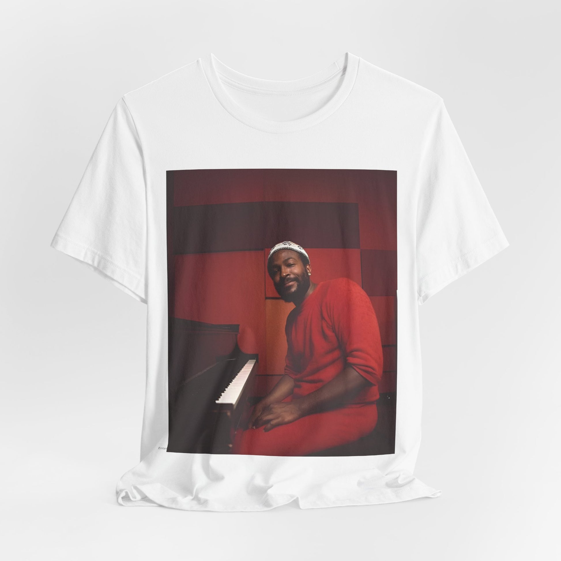 A black graphic t-shirt featuring a retro photo of Marvin Gaye playing the piano.