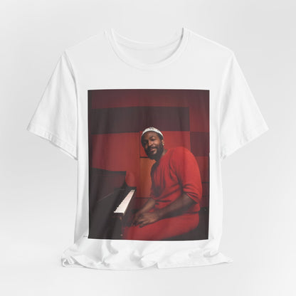 A black graphic t-shirt featuring a retro photo of Marvin Gaye playing the piano.