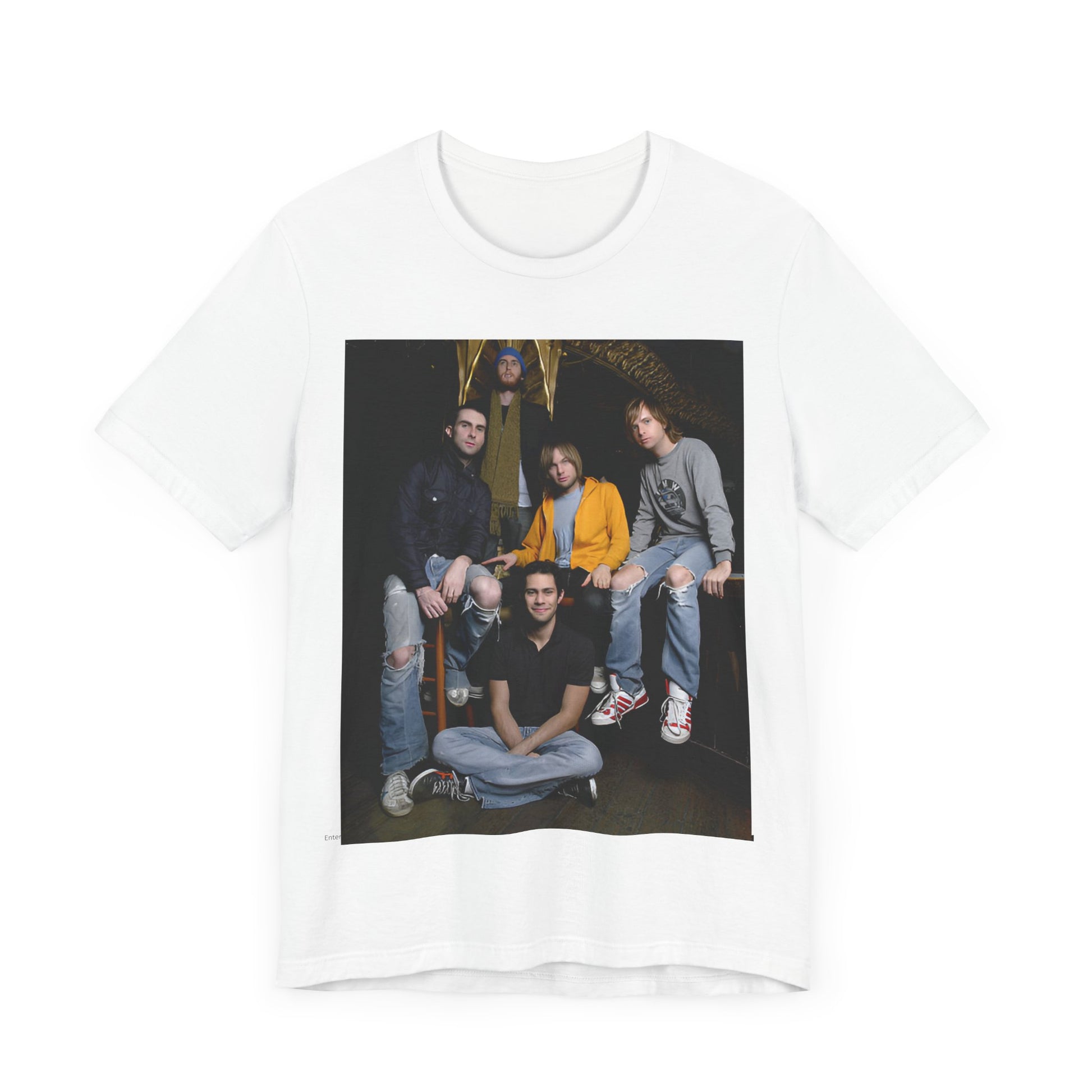 A high-energy, colorful photo of Maroon 5 performing live on stage at a concert, printed on a graphic t-shirt.