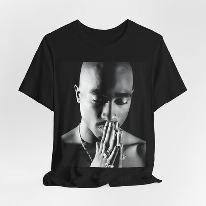 A black graphic t-shirt featuring a black and white streetwear rebel graphic of Tupac.