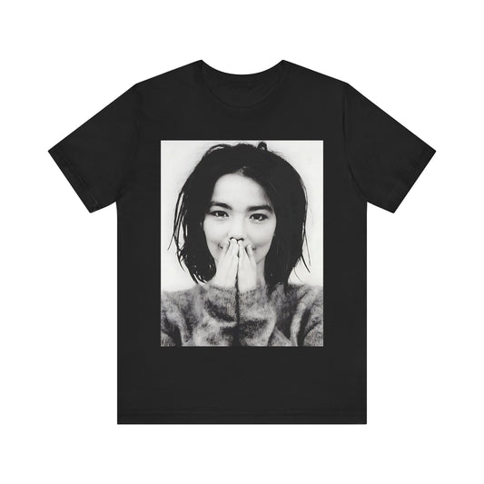 A black graphic t-shirt featuring a 90s black and white photographic portrait of Bjork.