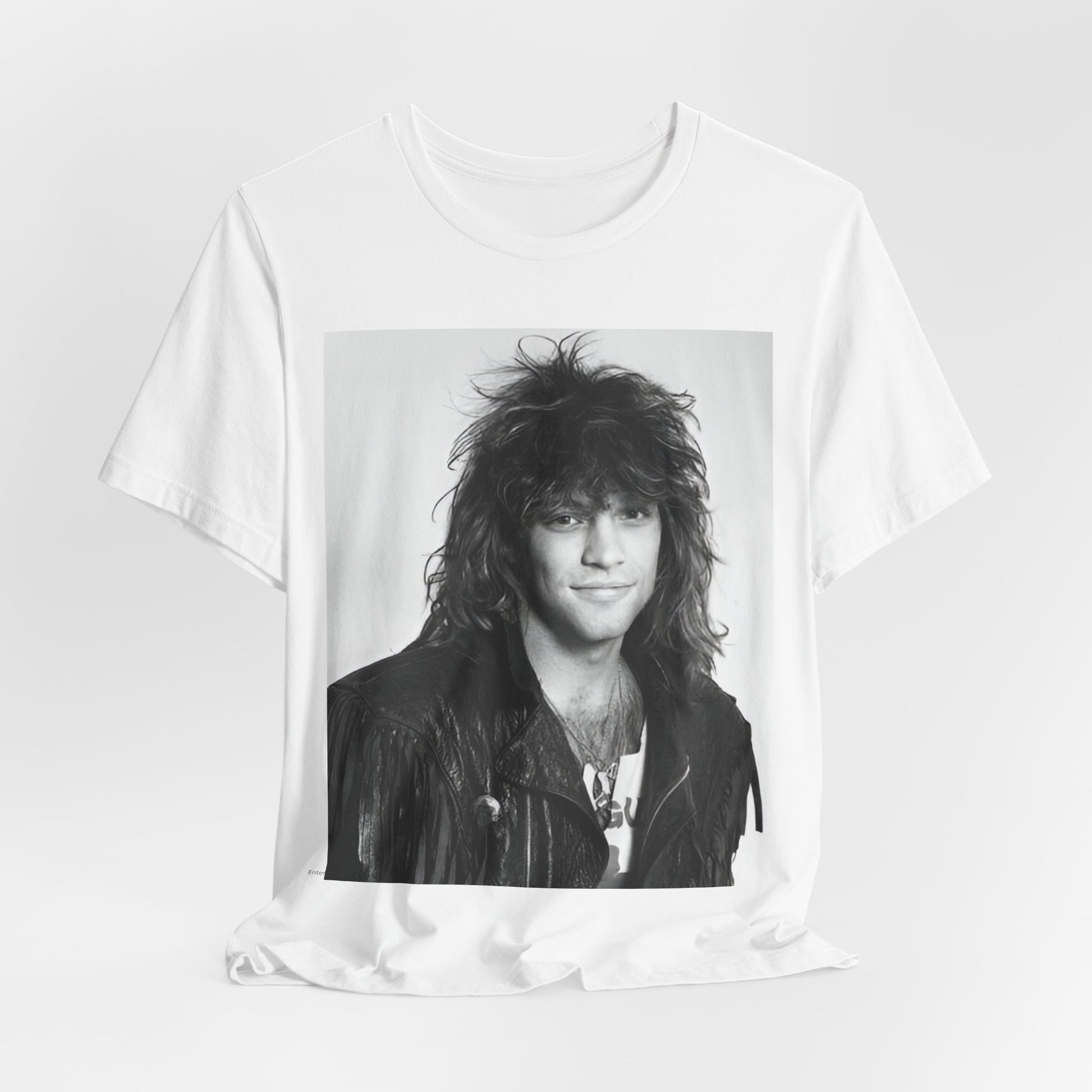 A black graphic t-shirt featuring a black and white photo of Bon Jovi from a 90s tour, performing on stage.