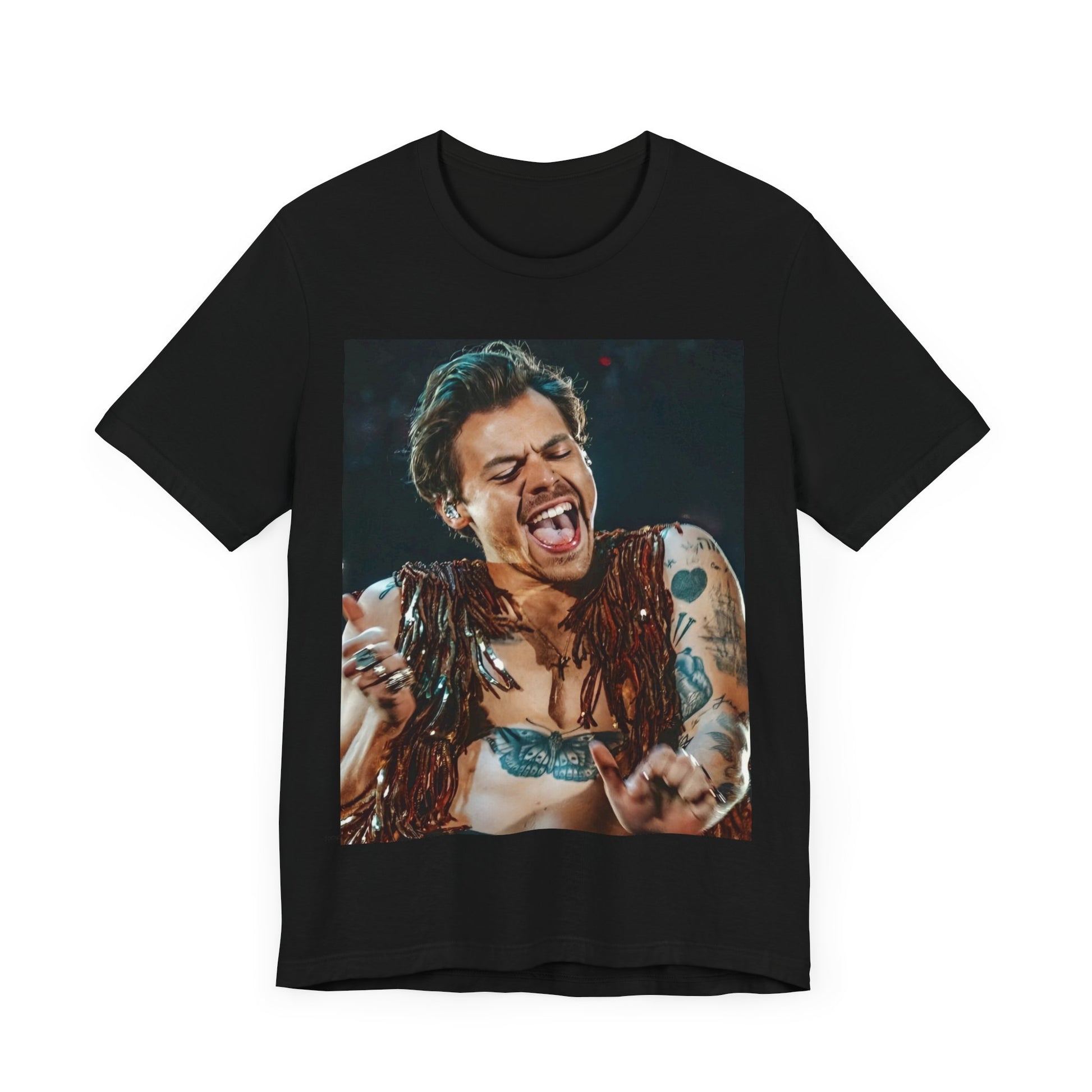 A black graphic t-shirt featuring a graphic or photo of Harry Styles performing live on stage.