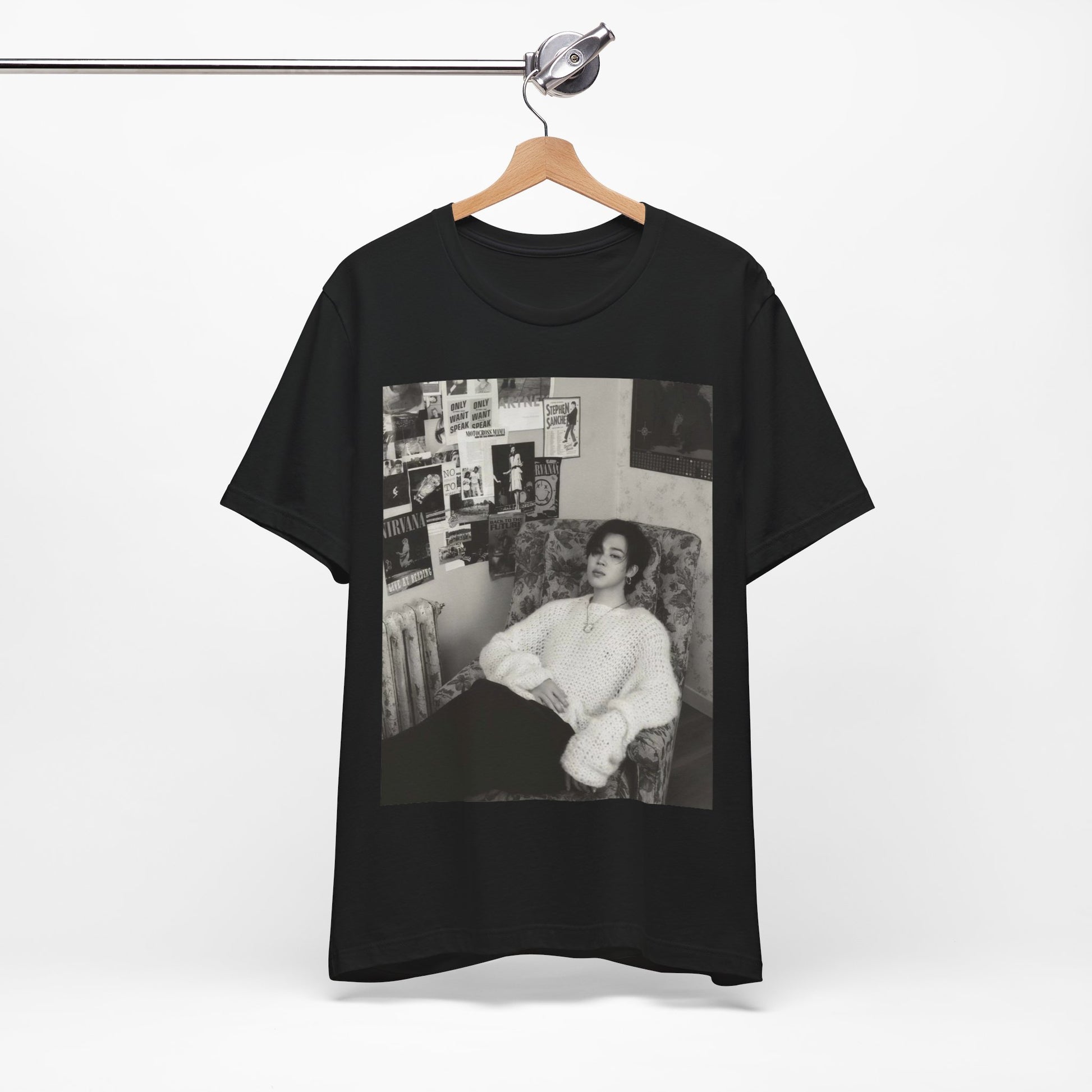 A black graphic t-shirt featuring a black and white portrait photo of Jimin.
