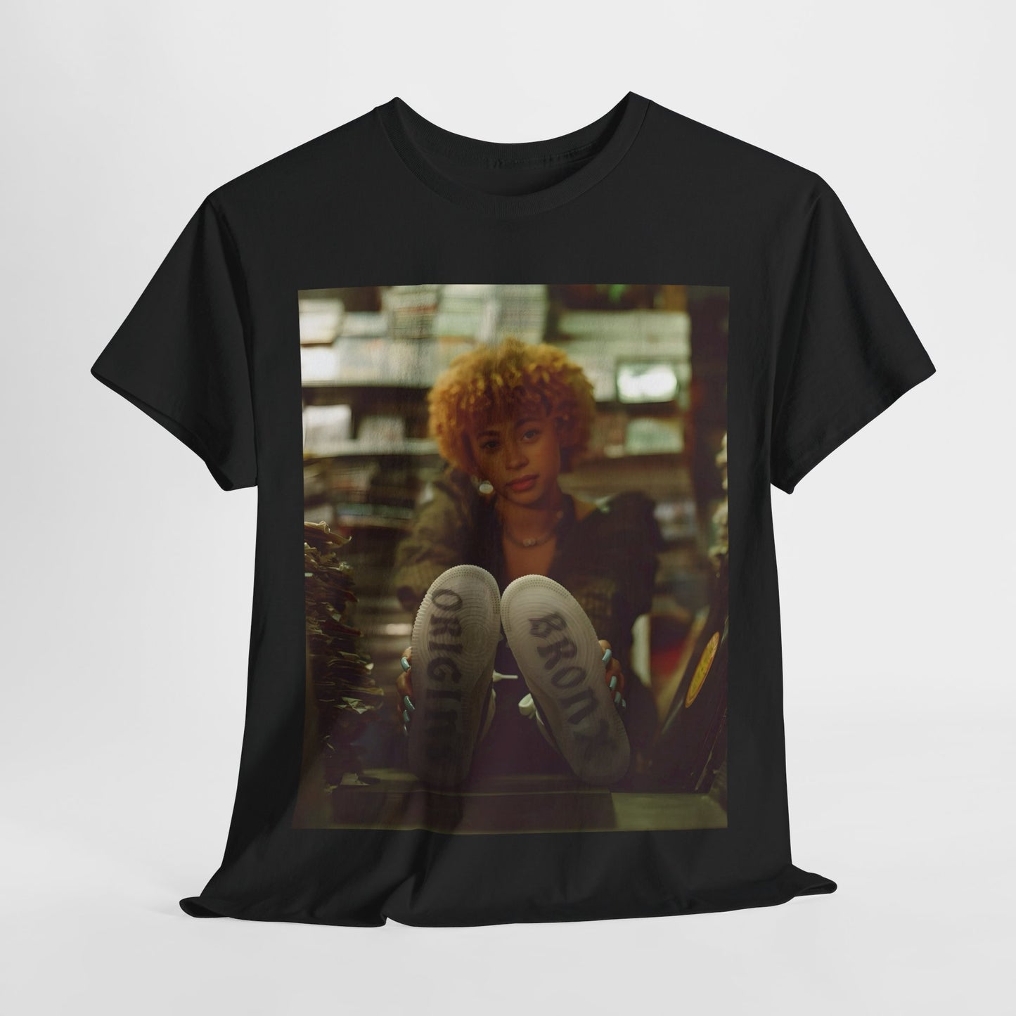 A black graphic t-shirt featuring a stylized graphic of Ice Spice as a TikTok Queen or global sensation.