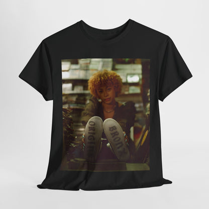 A black graphic t-shirt featuring a stylized graphic of Ice Spice as a TikTok Queen or global sensation.