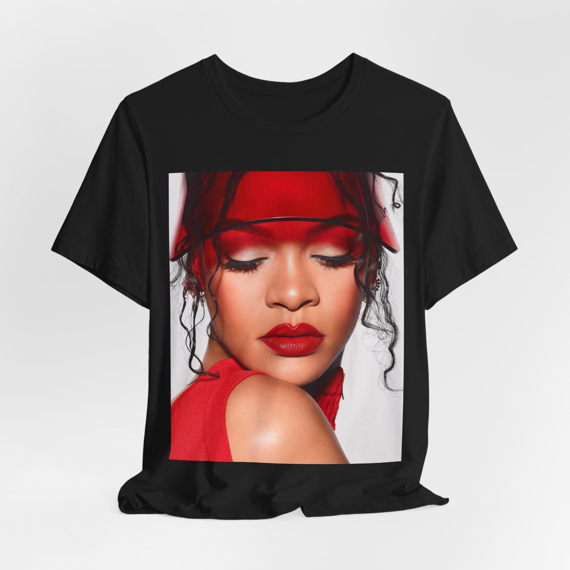 A black graphic t-shirt featuring a casual pop fan graphic of Rihanna.