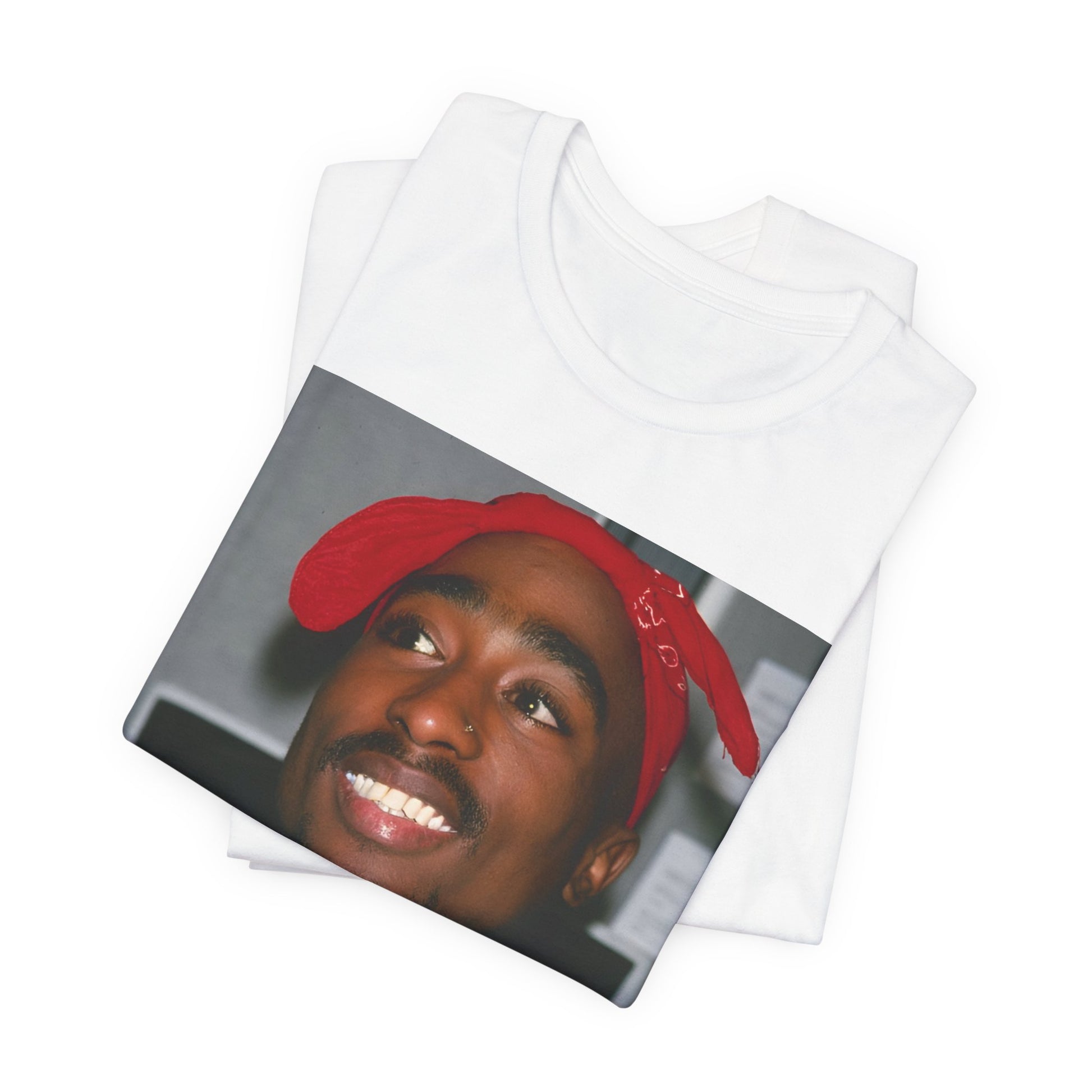 A black graphic t-shirt featuring a graphic of Tupac with his iconic bandana style.