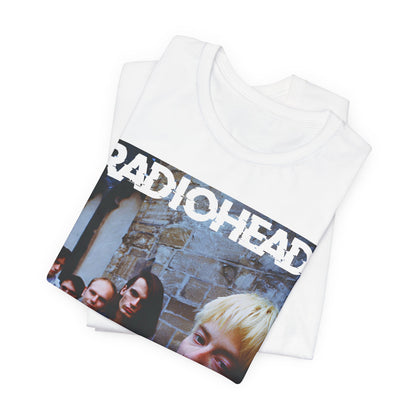 A black graphic t-shirt featuring a 90s graphic related to Radiohead's 'Karma Police' song or era.