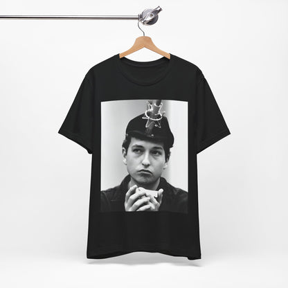 A black graphic t-shirt featuring a graphic of Bob Dylan in an acoustic session setting, possibly with his guitar.