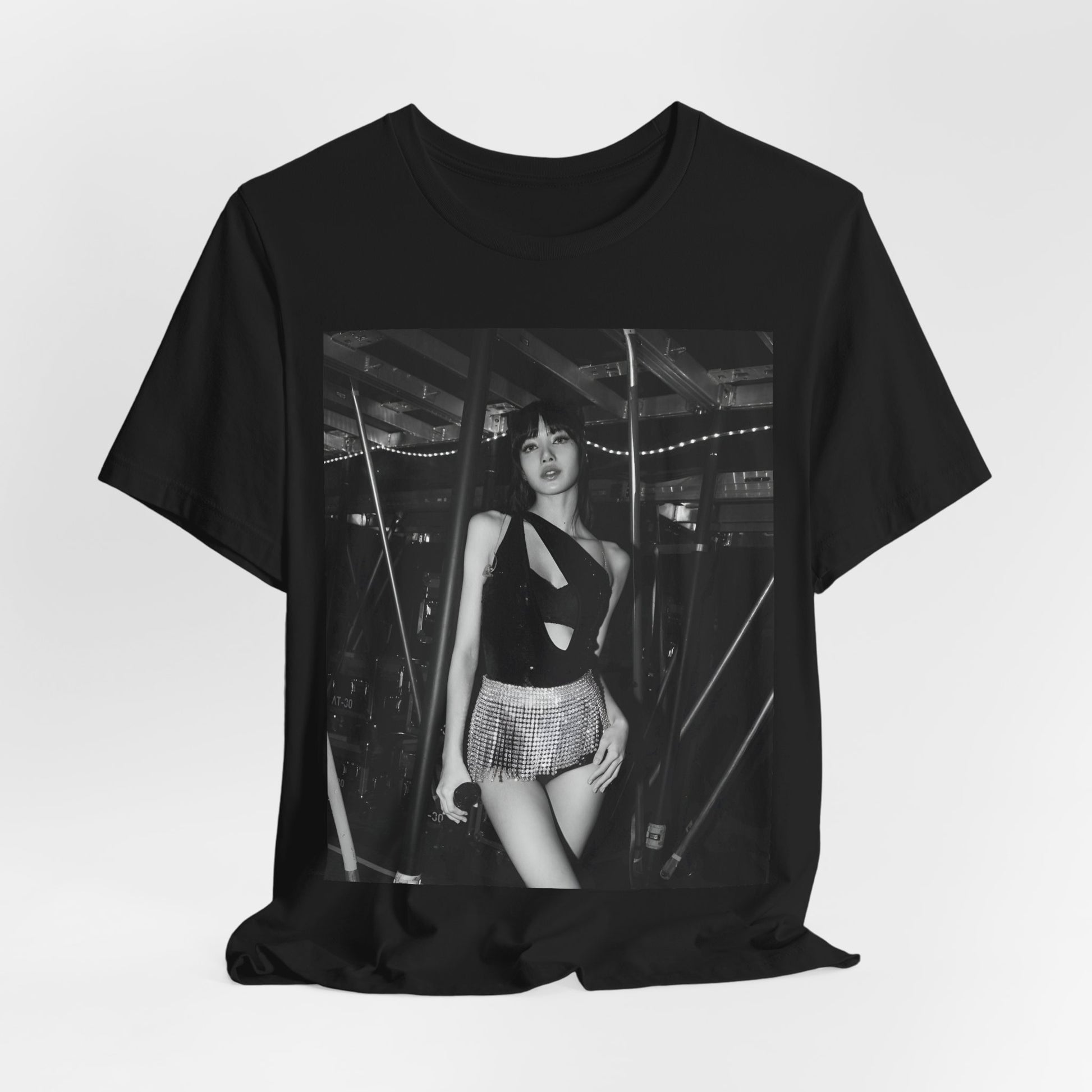A black graphic t-shirt featuring a black and white graphic or photo of Lisa in a backstage setting.