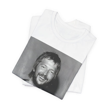 A black graphic t-shirt featuring a 70s photo portrait of Eric Clapton.