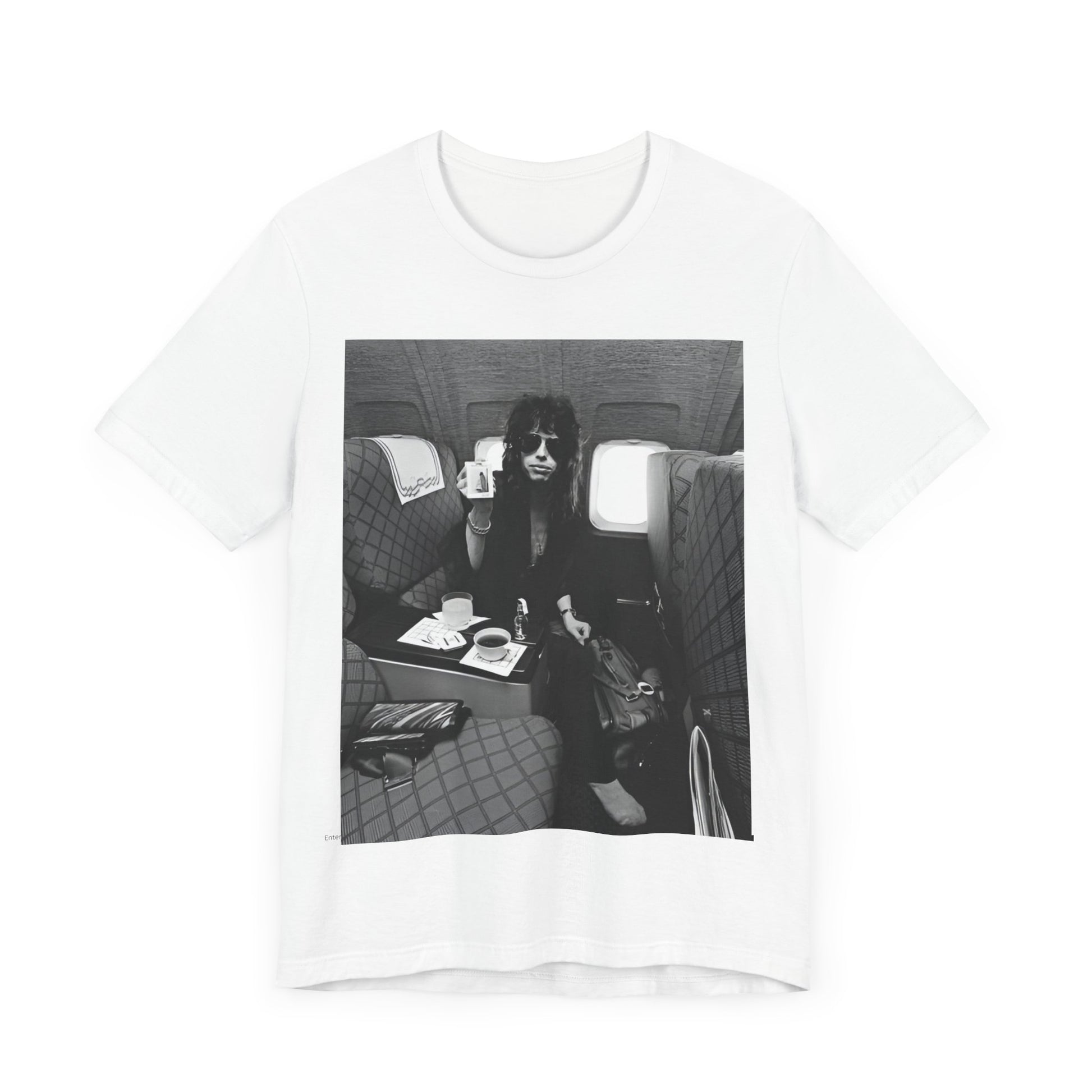 A black graphic t-shirt featuring a vintage 70s-style illustration of an airplane with Aerosmith branding, representing their tour plane from that era.
