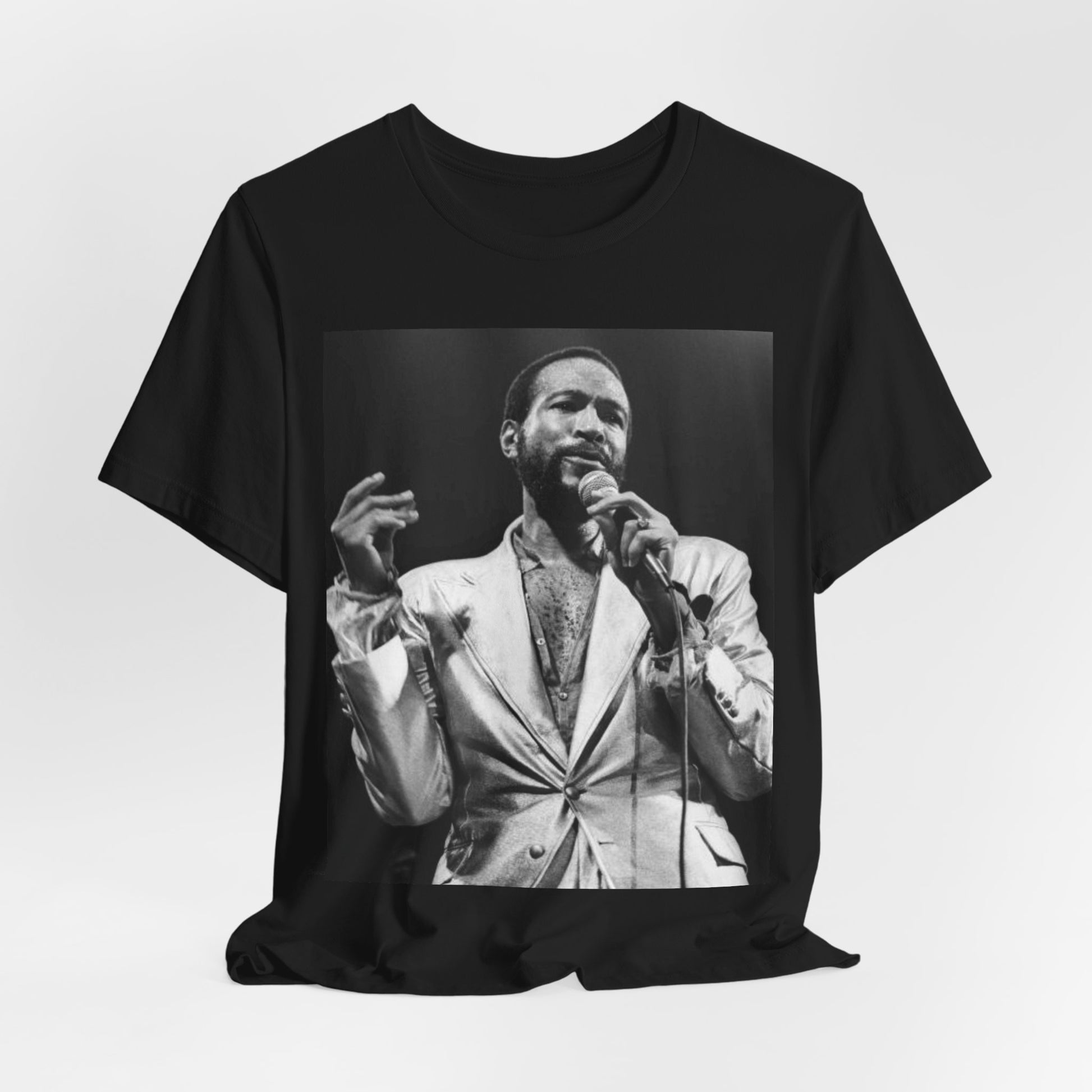 A black graphic t-shirt featuring a retro black and white photo or graphic of Marvin Gaye performing live on stage.