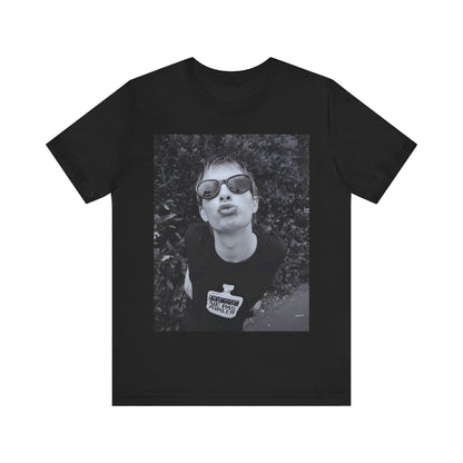 A black graphic t-shirt featuring a retro 90s graphic of Thom Yorke from Radiohead.