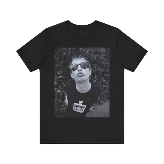 A black graphic t-shirt featuring a retro 90s graphic of Thom Yorke from Radiohead.