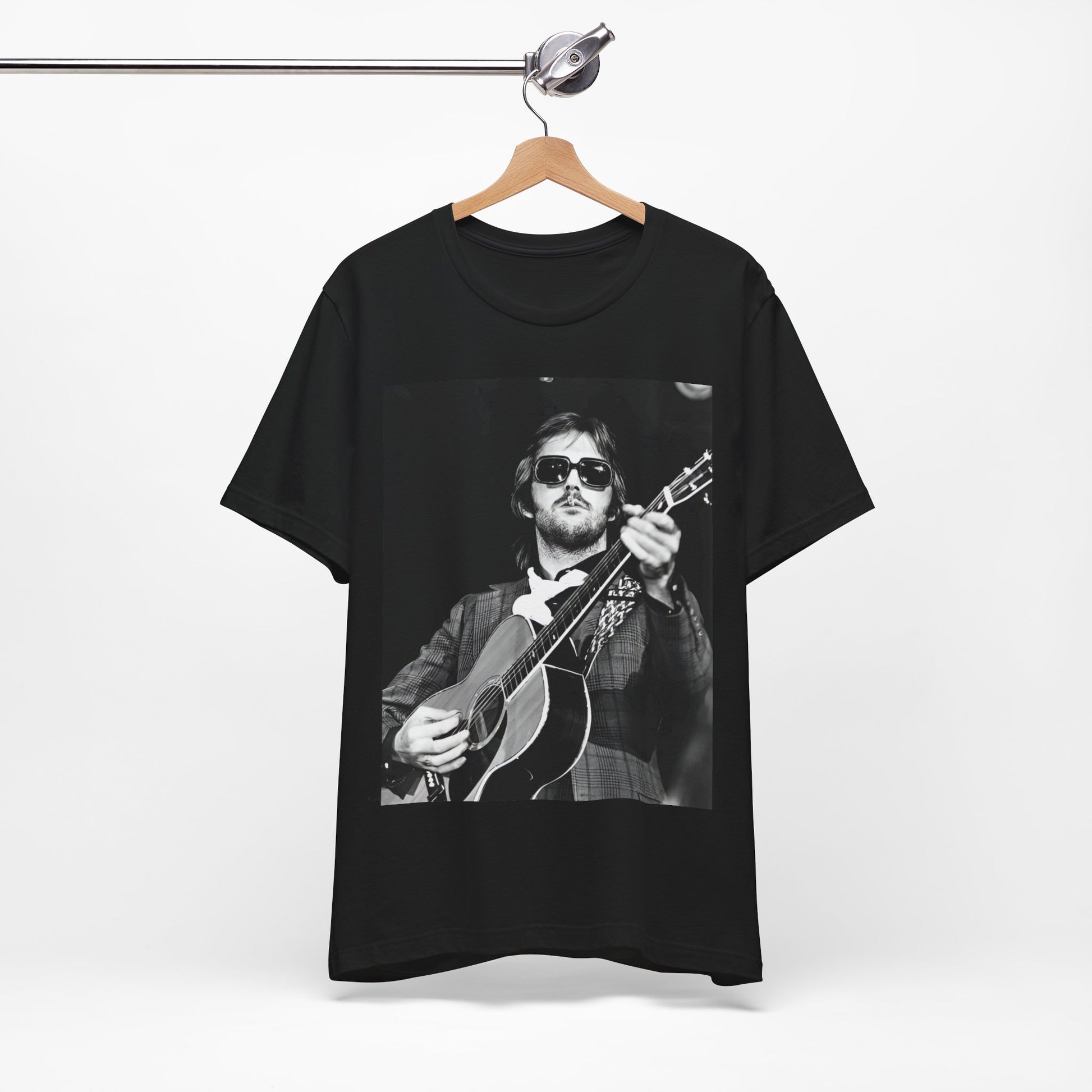 A black graphic t-shirt featuring a graphic of Eric Clapton with a chill blues rock vibe.