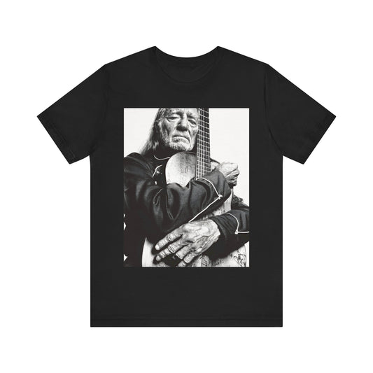A black graphic t-shirt featuring a vintage country legend graphic of Willie Nelson.