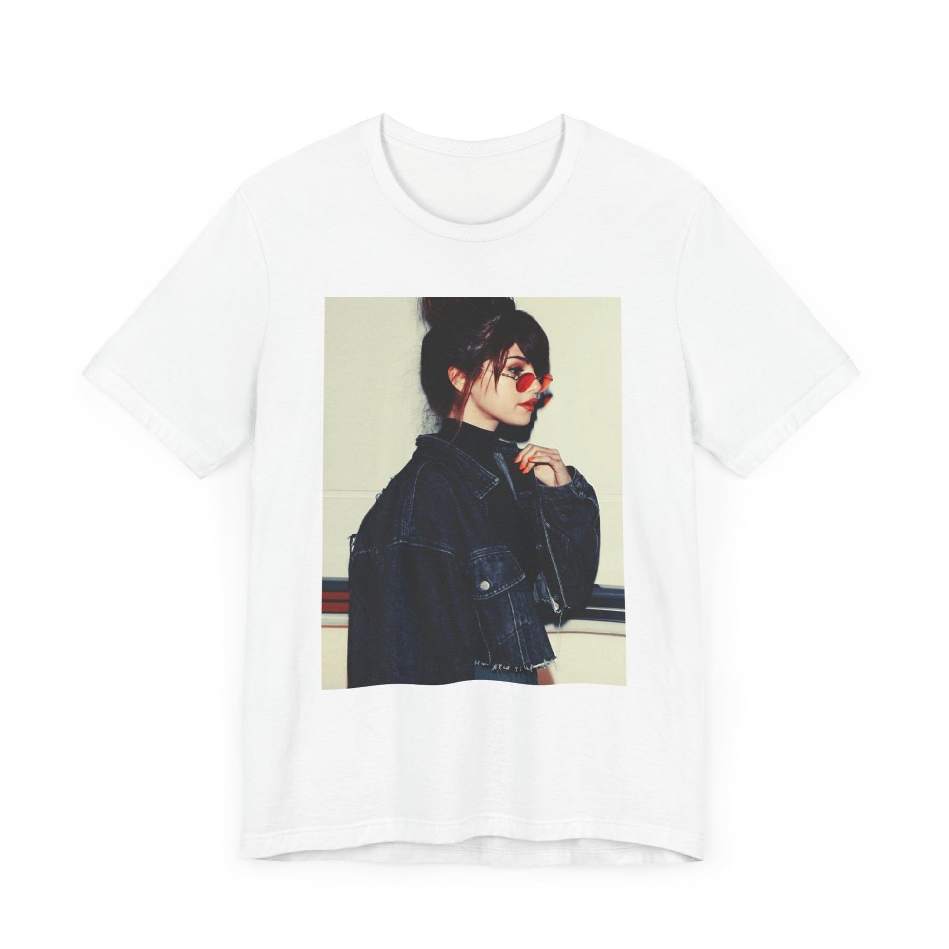 A black graphic t-shirt featuring a bold graphic of Selena Gomez as a pop superstar.
