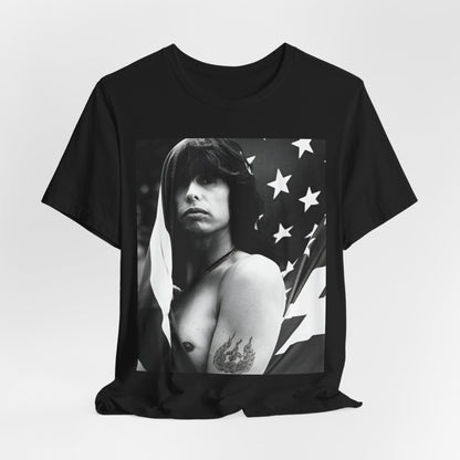A black graphic t-shirt featuring a retro 70s-style illustration or photo of Aerosmith, integrated with elements of the American flag.