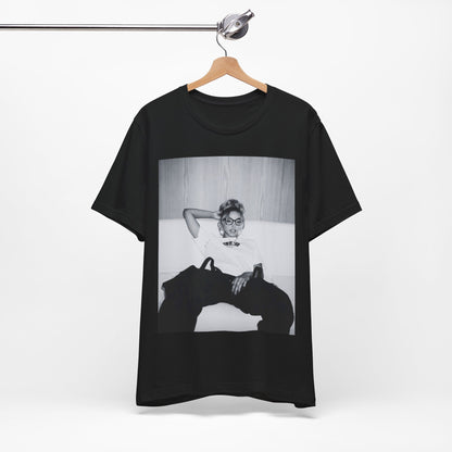 A black graphic t-shirt featuring a black and white portrait photo of Tinashe.