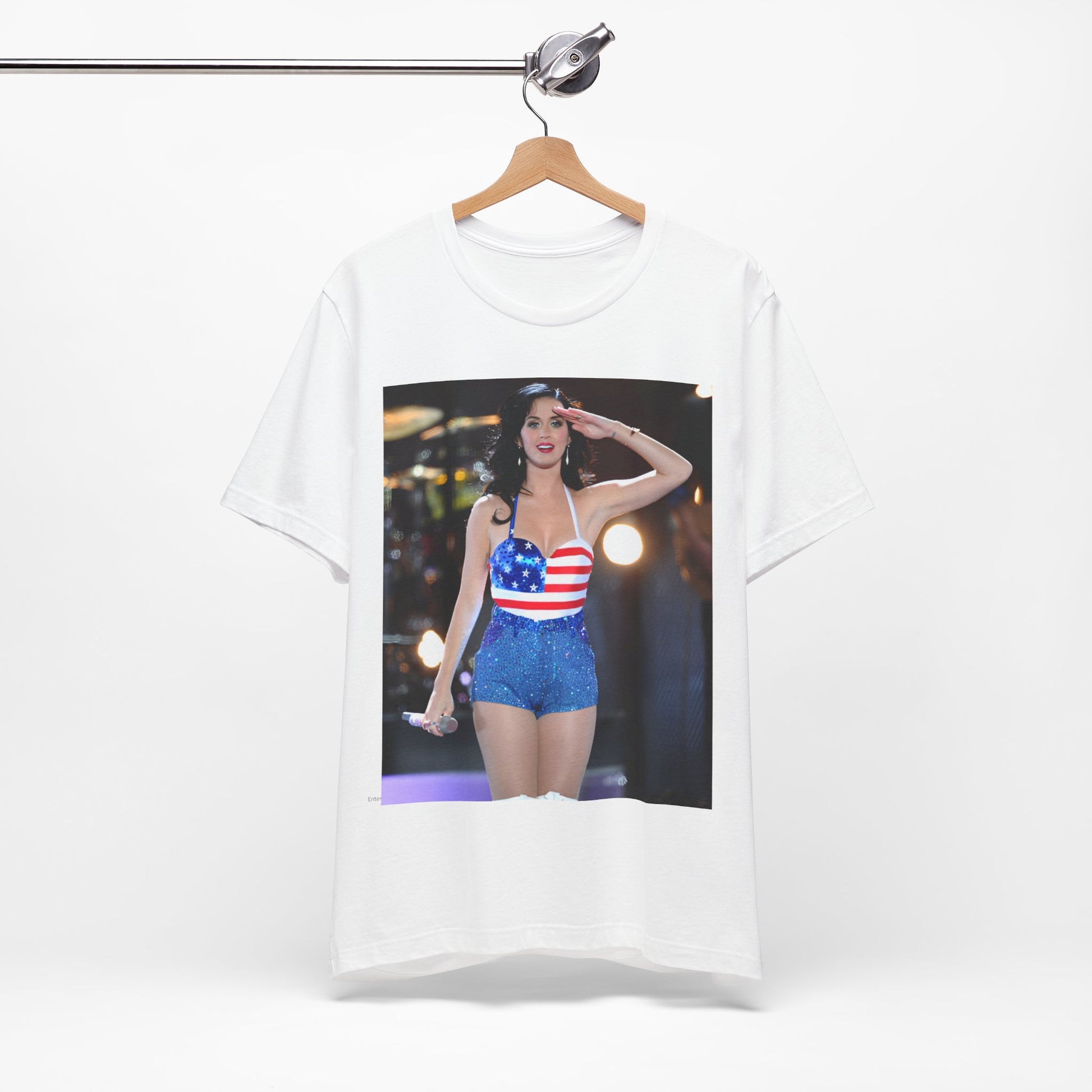 A black graphic t-shirt featuring a vintage graphic related to Katy Perry's 'Firework' song or era.