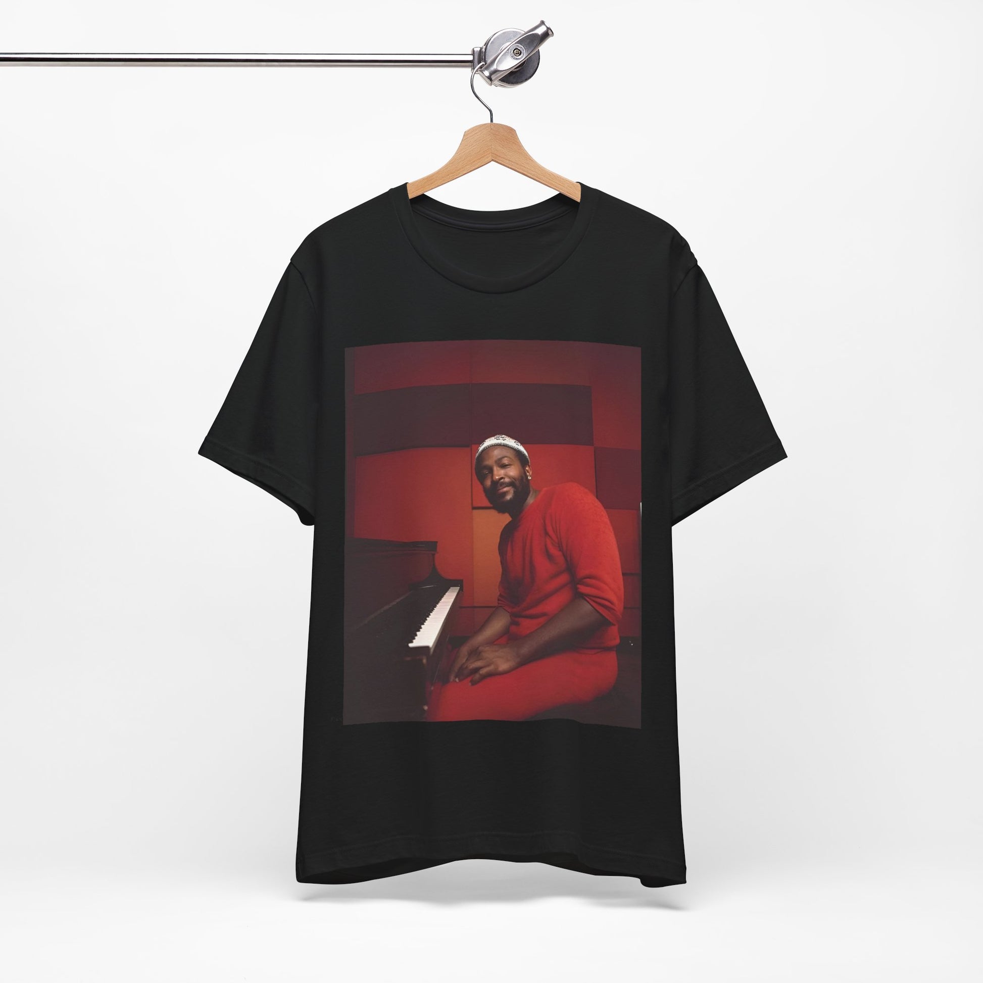 A black graphic t-shirt featuring a retro photo of Marvin Gaye playing the piano.